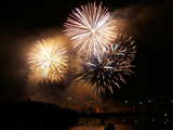 Firework on the Rhine 2007, big yellow and white flowers above the Rhine, eve of 1st August, Basle, Switzerland