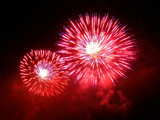 Firework on the Rhine 2007, red flowers with white heart like the swiss flag, eve of 1st August, Basle, Switzerland