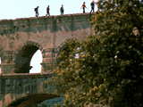 People walking on the top of the Pont du Gard, 49m, must not be suffering from vertigo!