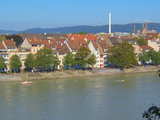 The Rhine in Basle, Switzerland, between the middle bridge and the Wettstein bridge, the banks of *small Basle*, in the background the Chrischona, the radio and TV transmtting tower of Basle