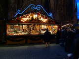 Christmas market, gingerbread and other gifts, in front of the cathedral of Strasbourg, Alsace, France, December 2011.