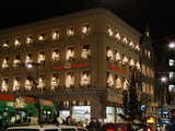 Xmas street illumination, House decorated with an illuminated xmas tree at each window, at the square of the barefoot, Barfuesserplatz in Basel, Switzerland, December 2005